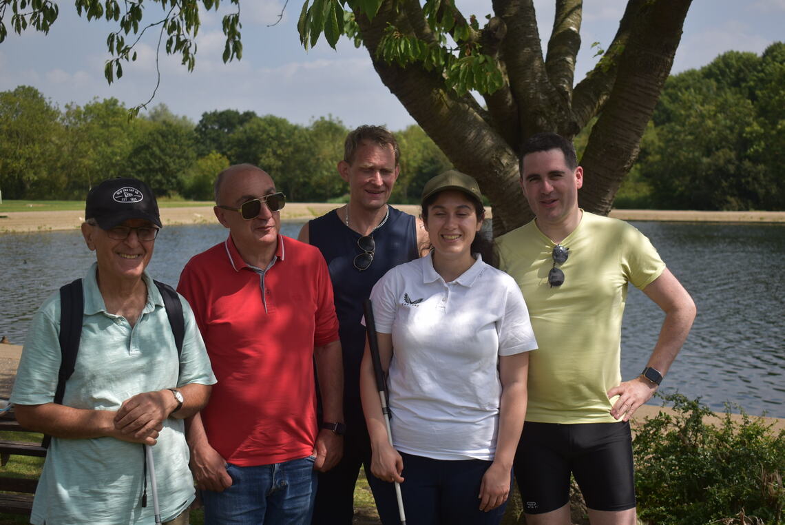 A group people are together taking a photo.